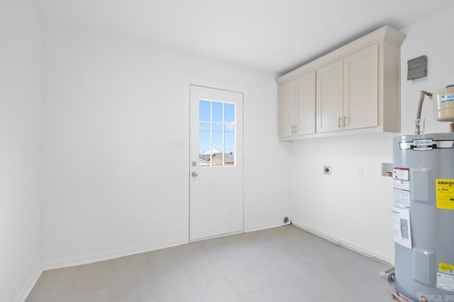 washroom featuring cabinets, hookup for a washing machine, electric water heater, and electric dryer hookup