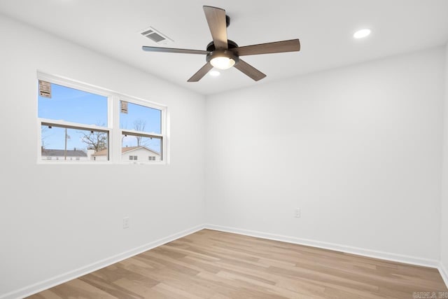 spare room featuring ceiling fan and light hardwood / wood-style floors