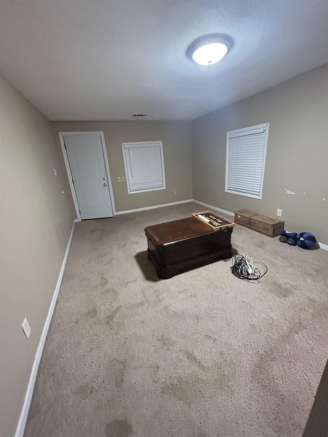 unfurnished bedroom with carpet flooring