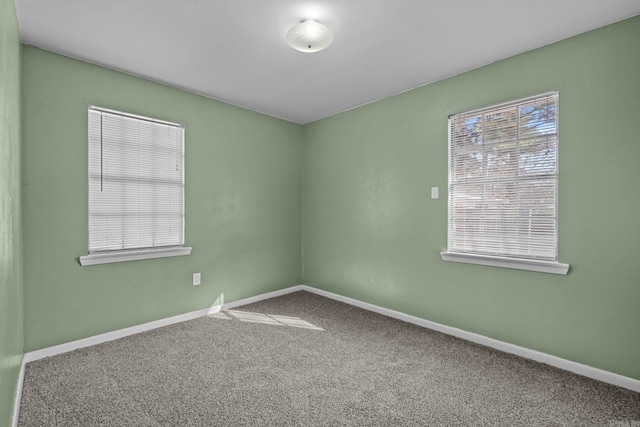 empty room with carpet flooring