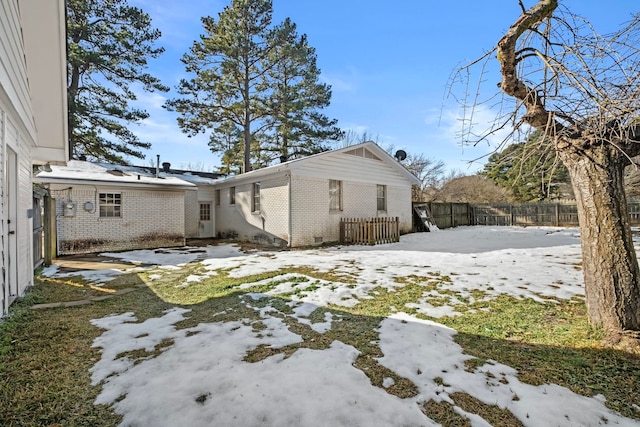 view of snow covered property