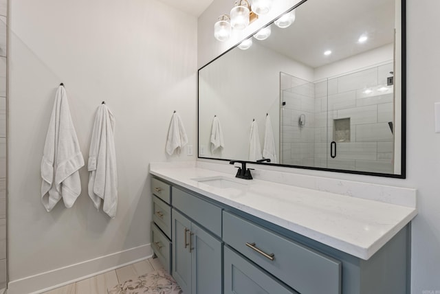 bathroom with vanity and an enclosed shower