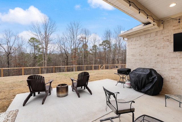 view of patio featuring a fire pit and grilling area