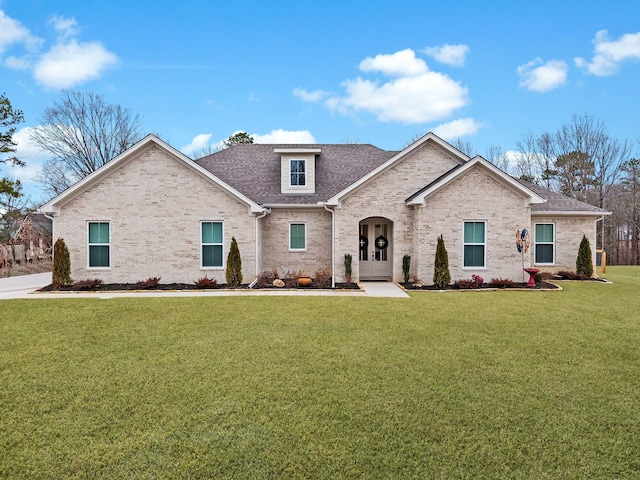 view of front of house featuring a front yard and french doors