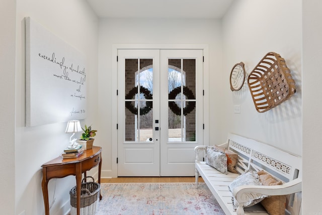 doorway to outside featuring french doors and light hardwood / wood-style flooring