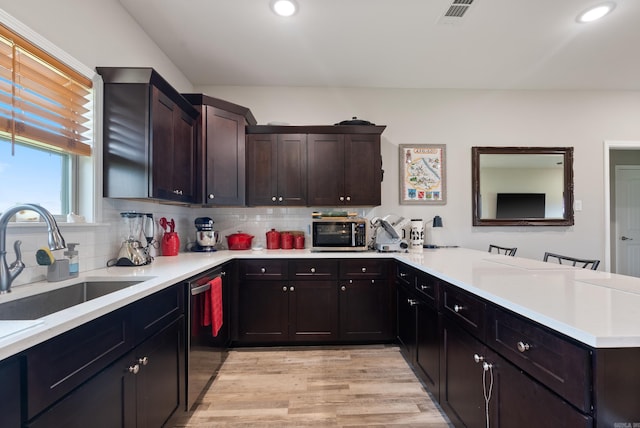 kitchen with dark brown cabinetry, sink, tasteful backsplash, light hardwood / wood-style flooring, and dishwasher