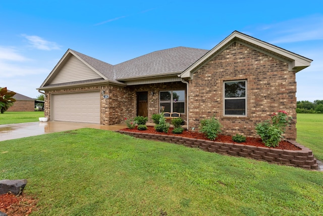 view of front of house featuring a garage and a front lawn