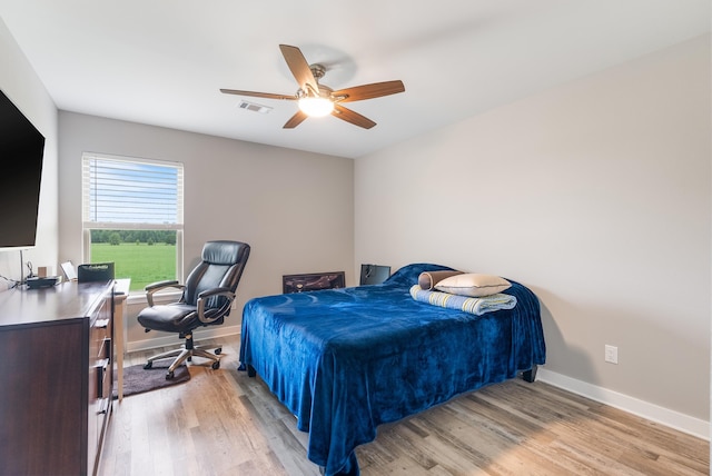 bedroom featuring ceiling fan and light wood-type flooring