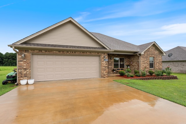 view of front of house with a garage and a front yard