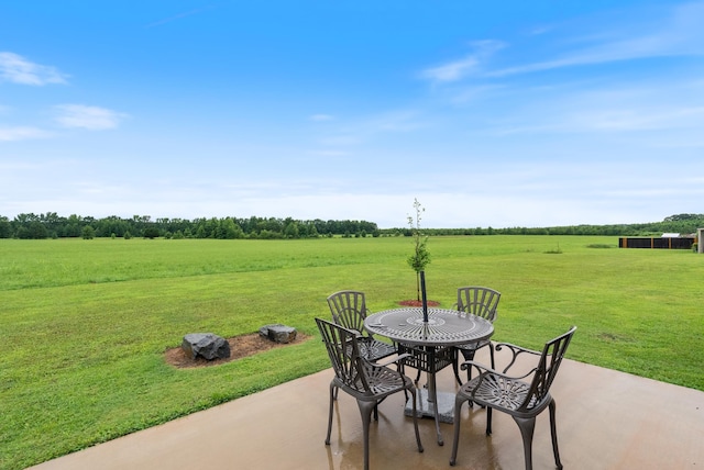 view of patio / terrace with a rural view