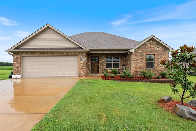 view of front of home with a garage and a front yard