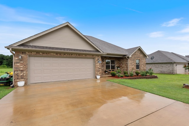 view of front of property featuring a garage and a front yard