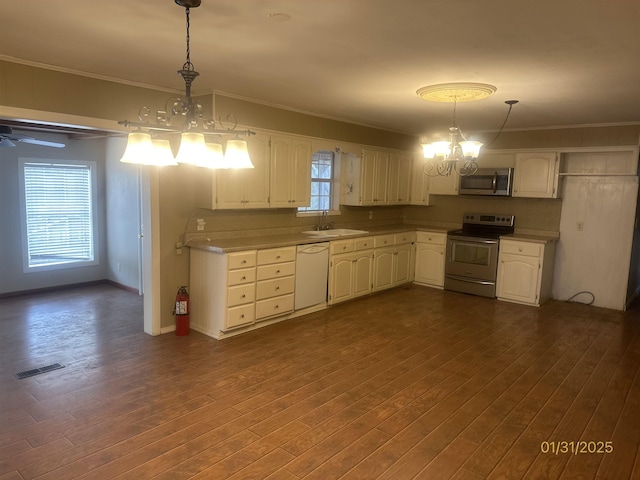 1013 Elm St, Coal Hill, AR 72832 - kitchen featuring stainless steel appliances, hanging light fixtures, sink, and dark hardwood / wood-style flooring