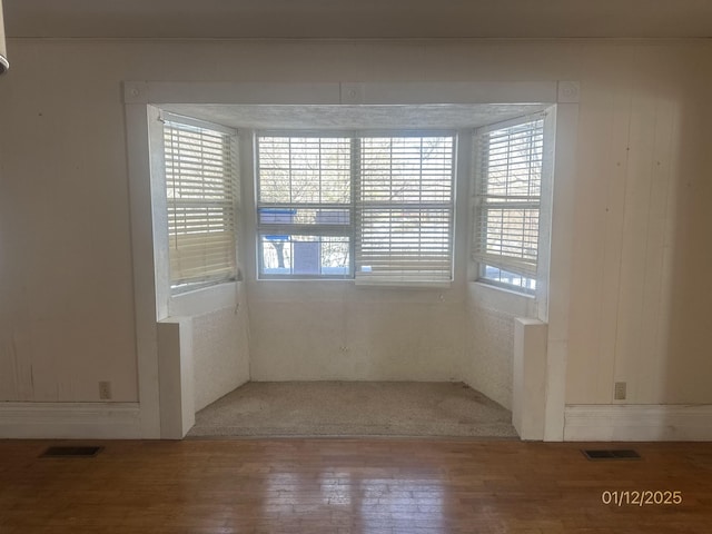 1013 Elm St, Coal Hill, AR 72832 - empty room featuring hardwood / wood-style flooring and a healthy amount of sunlight