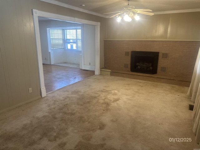 1013 Elm St, Coal Hill, AR 72832 - unfurnished living room with crown molding, light colored carpet, ceiling fan, and a brick fireplace