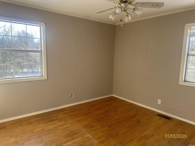 1013 Elm St, Coal Hill, AR 72832 - spare room with hardwood / wood-style flooring, ornamental molding, and ceiling fan
