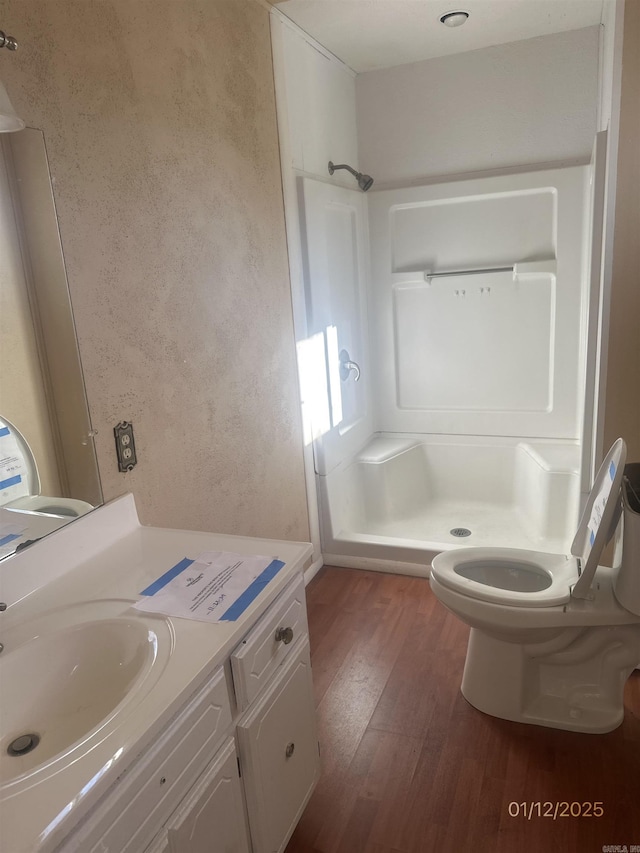 1013 Elm St, Coal Hill, AR 72832 - bathroom with vanity, hardwood / wood-style flooring, toilet, and a shower