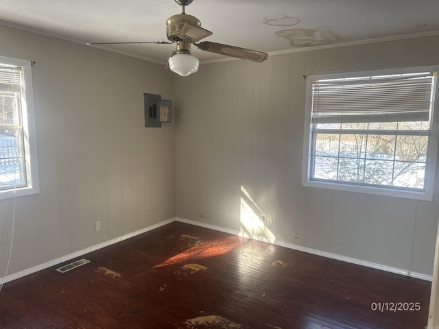 1013 Elm St, Coal Hill, AR 72832 - empty room featuring crown molding, ceiling fan, electric panel, and dark hardwood / wood-style flooring