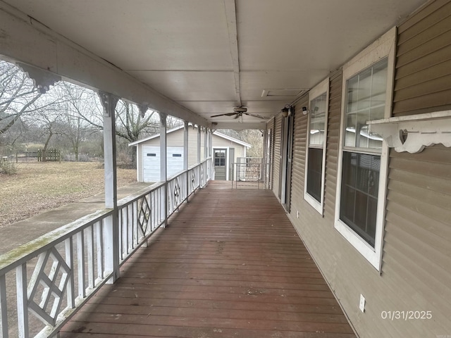 1013 Elm St, Coal Hill, AR 72832 - deck featuring ceiling fan and covered porch
