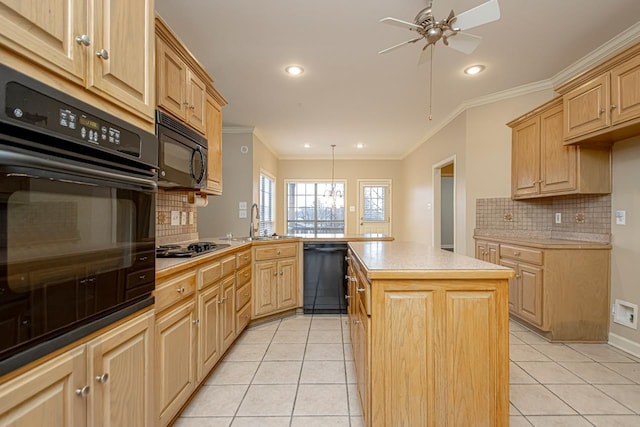 kitchen with sink, a center island, light tile patterned floors, and black appliances