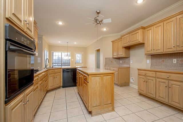 kitchen featuring hanging light fixtures, a kitchen island, light tile patterned floors, and black appliances