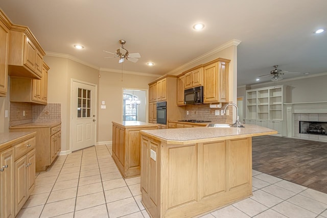 kitchen featuring sink, ceiling fan, black appliances, kitchen peninsula, and light brown cabinets