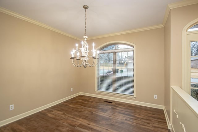 unfurnished dining area featuring dark hardwood / wood-style flooring, a notable chandelier, and crown molding