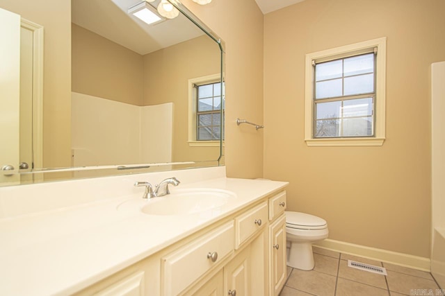 full bathroom with tile patterned flooring, vanity, shower with separate bathtub, and toilet