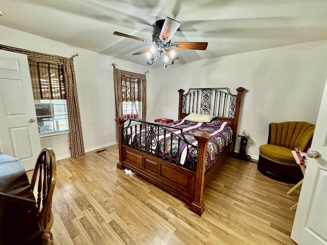 bedroom with ceiling fan and light hardwood / wood-style floors