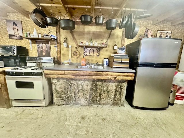 kitchen with sink and appliances with stainless steel finishes