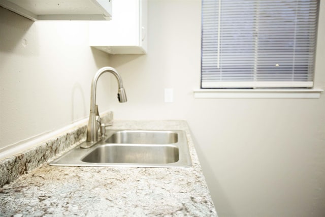 kitchen with sink and white cabinets