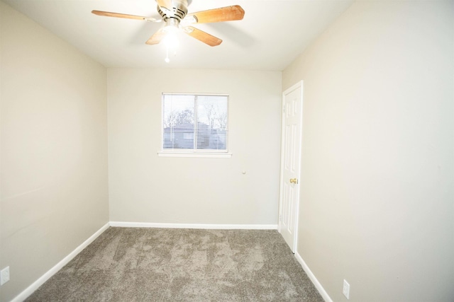 spare room featuring ceiling fan and light carpet