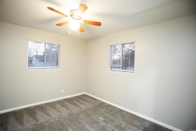 empty room featuring carpet flooring and ceiling fan