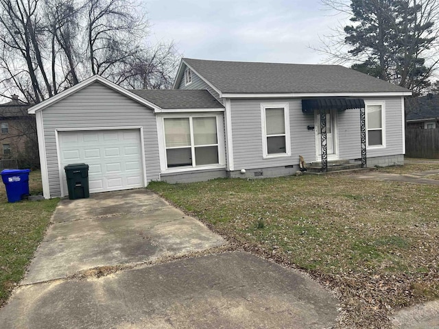 ranch-style home with a garage and a front lawn