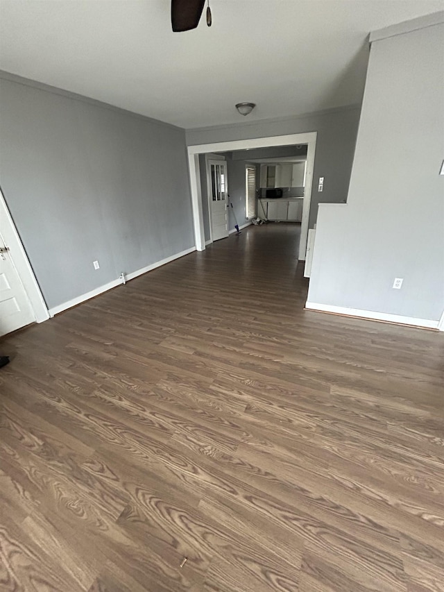 interior space featuring ceiling fan and dark hardwood / wood-style floors