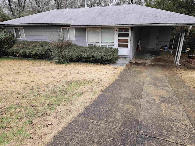 single story home featuring a carport