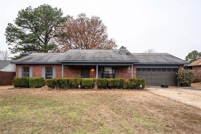 single story home with a garage and a front yard