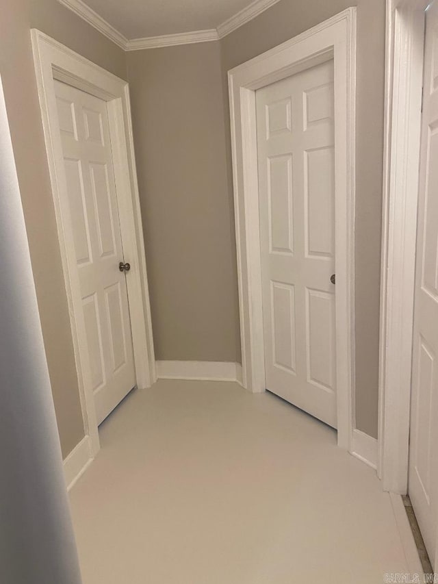 hallway with light carpet and ornamental molding