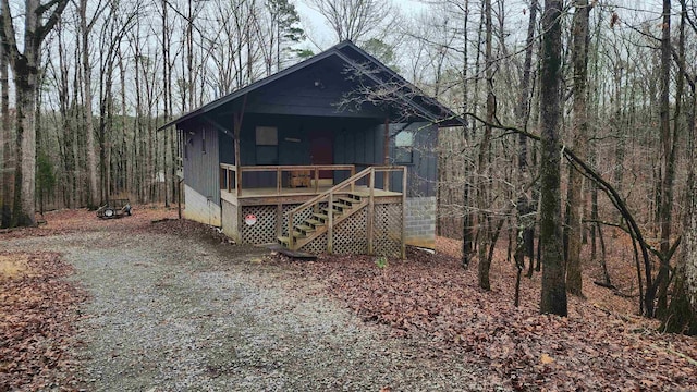 view of outdoor structure with a sunroom