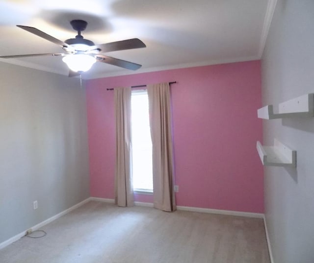 unfurnished room featuring ornamental molding, plenty of natural light, and ceiling fan