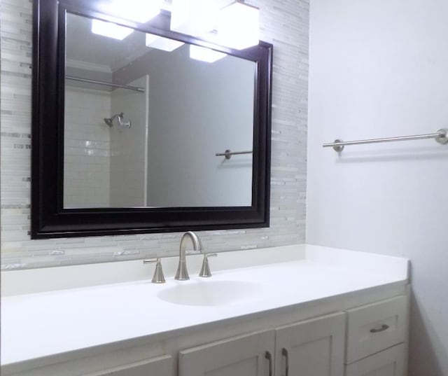 bathroom featuring vanity and a shower