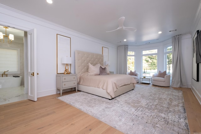 bedroom featuring crown molding, ceiling fan with notable chandelier, and hardwood / wood-style floors