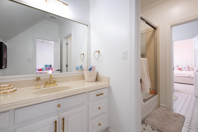 bathroom with vanity, shower / bath combination with glass door, and vaulted ceiling