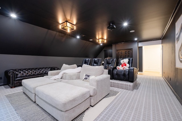 home theater featuring light colored carpet and lofted ceiling