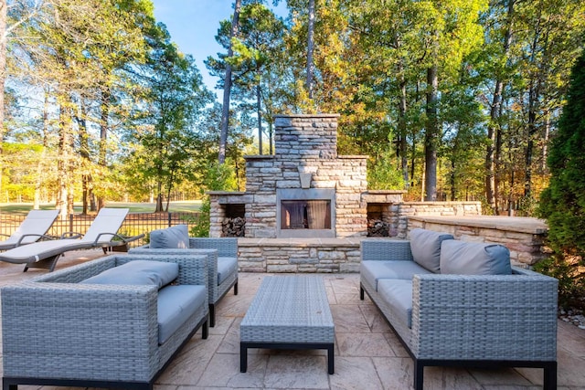 view of patio featuring an outdoor living space with a fireplace