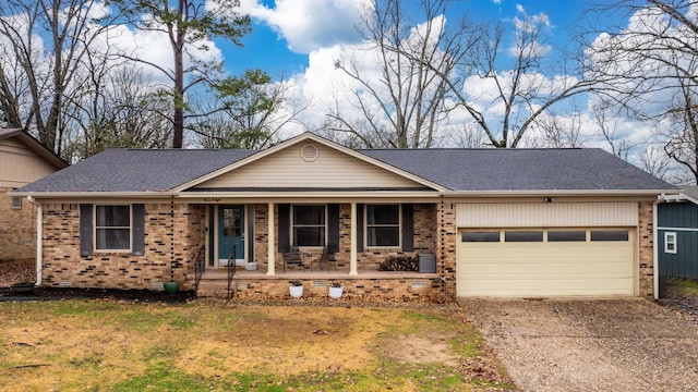 single story home with a porch and a garage