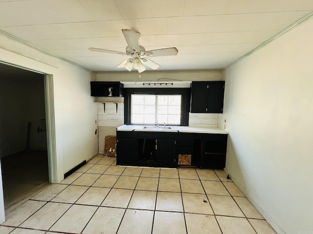 kitchen with sink, ceiling fan, and light tile patterned flooring