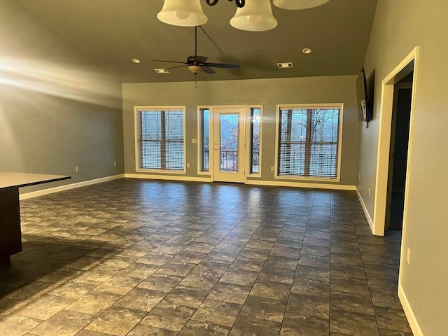 unfurnished living room featuring ceiling fan