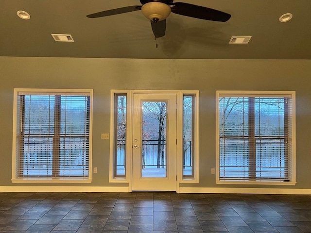 doorway to outside with ceiling fan