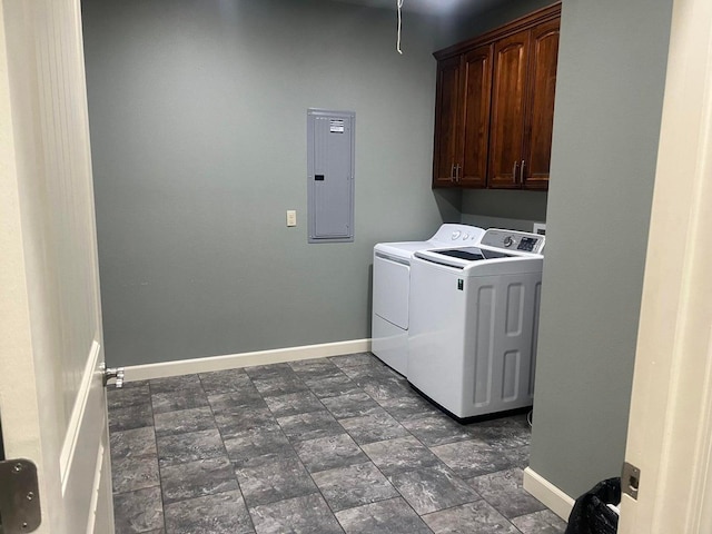 laundry area with cabinets, independent washer and dryer, and electric panel